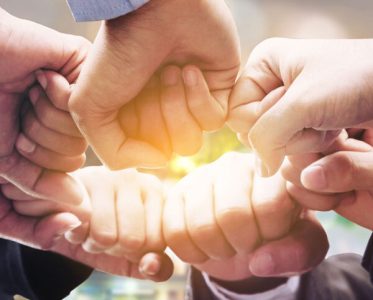 partnership-several-hands-fist-pump-1200x776-1-aspect-ratio-600-483